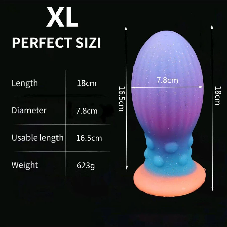 Plug anal en silicone « œuf » extra-large phosphorescent avec ventouse, 18 x 7,8 cm - Multicolore