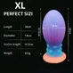 Plug anal en silicone « œuf » extra-large phosphorescent avec ventouse, 18 x 7,8 cm - Multicolore