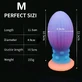 Plug anal din silicon de dimensiuni medii, care strălucește în întuneric, cu ventuză, 11,5 x 4,9 cm – Multicolor