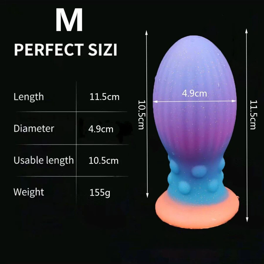 Plug anal din silicon de dimensiuni medii, care strălucește în întuneric, cu ventuză, 11,5 x 4,9 cm – Multicolor